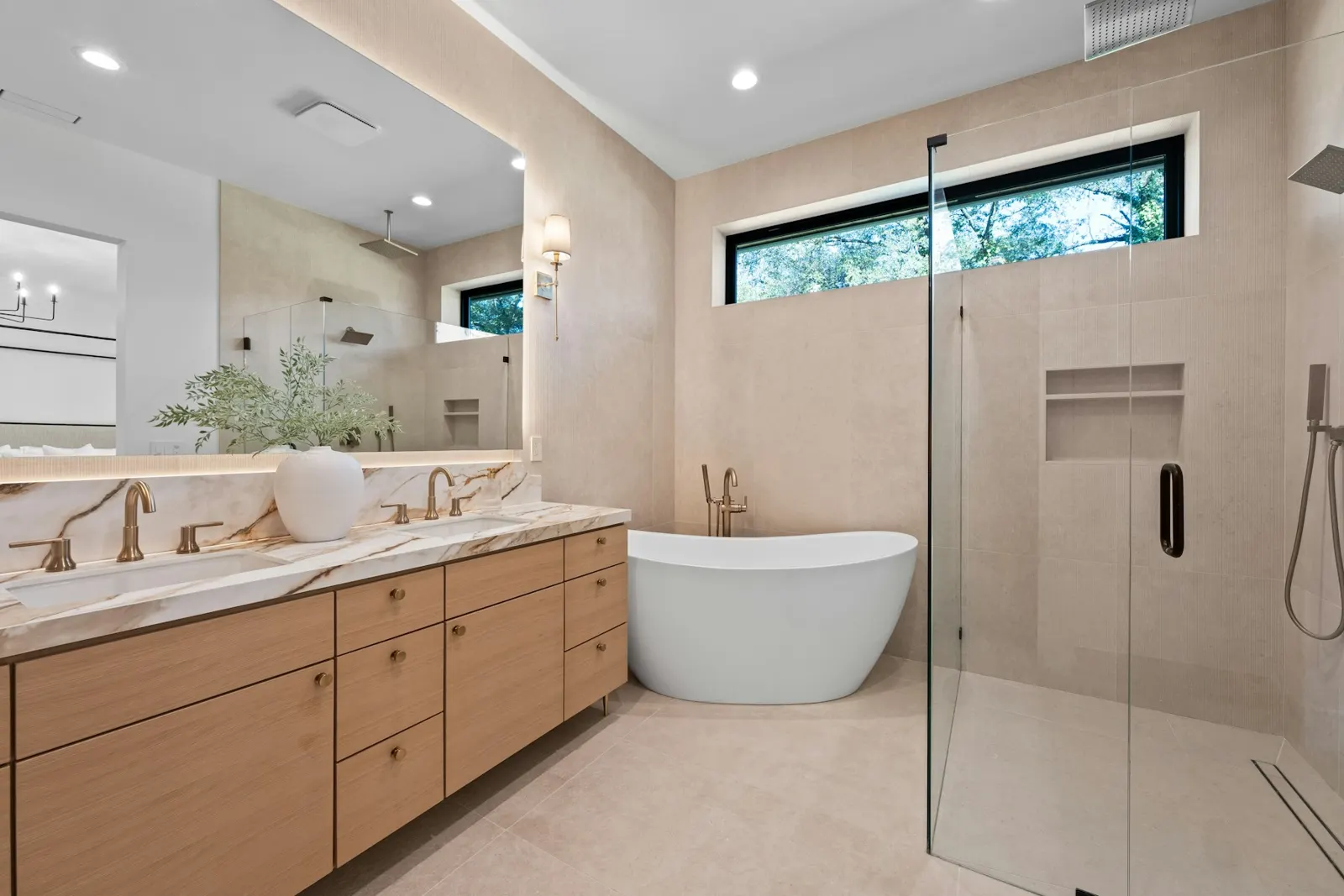 Contemporary bathroom with freestanding bath and timber vanity