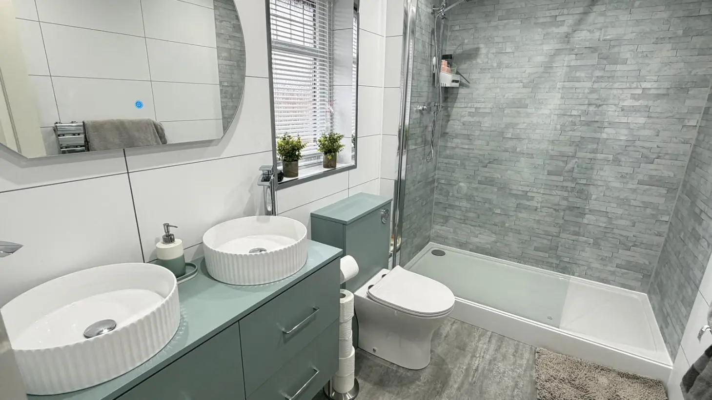 Sage double vanity and glass shower